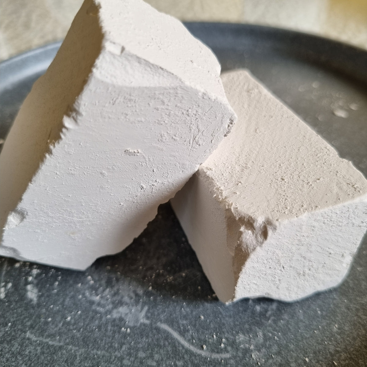 Close-up of two broken Dobryj chalk pieces with visible fracture edges