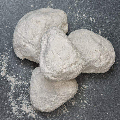 Top view of stacked white Halva chalk pieces with rough, powdery surfaces