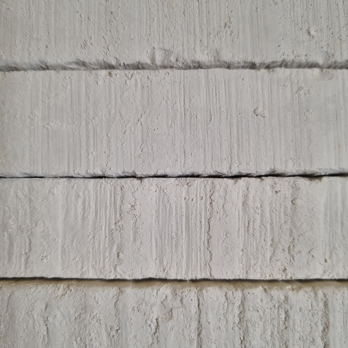 New Oskol natural white chalk pieces of different sizes with rough textures and chipped corners.