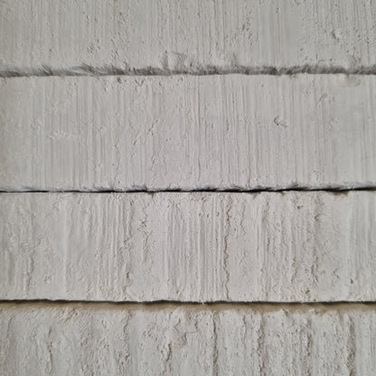 New Oskol natural white chalk pieces of different sizes with rough textures and chipped corners.