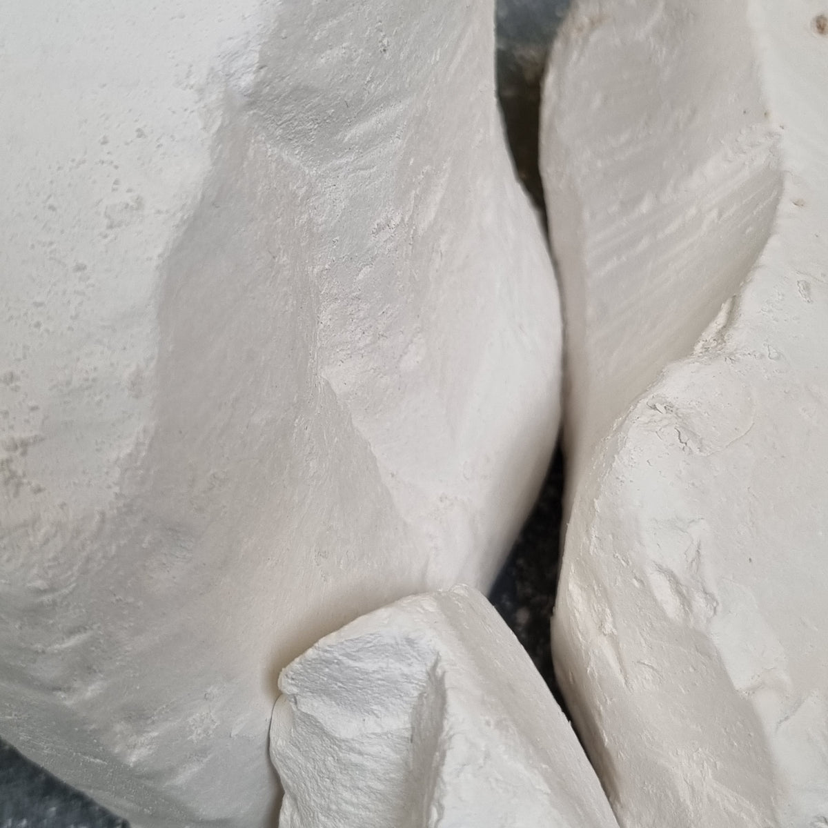 Close-up of Premium natural white chalk pieces showing fine surface texture and broken edges.
