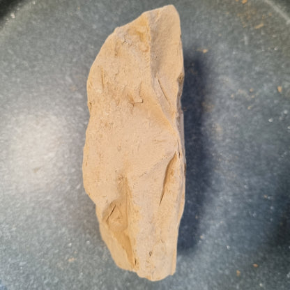 Side view of an elongated Turkestan Slivki clay piece with natural cracks and uneven edges