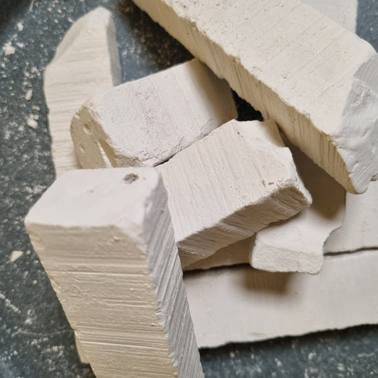Stacked pieces of Vatutin natural white chalk with visible surface ridges and rough broken edges.